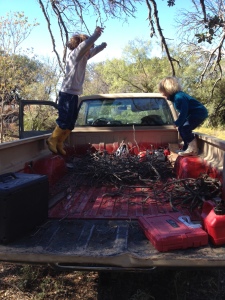Grant and Cora stomping down our kindling for more space.