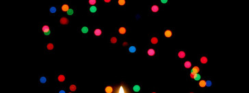 Candle and Christmas Tree by Lois Elling at Flickr